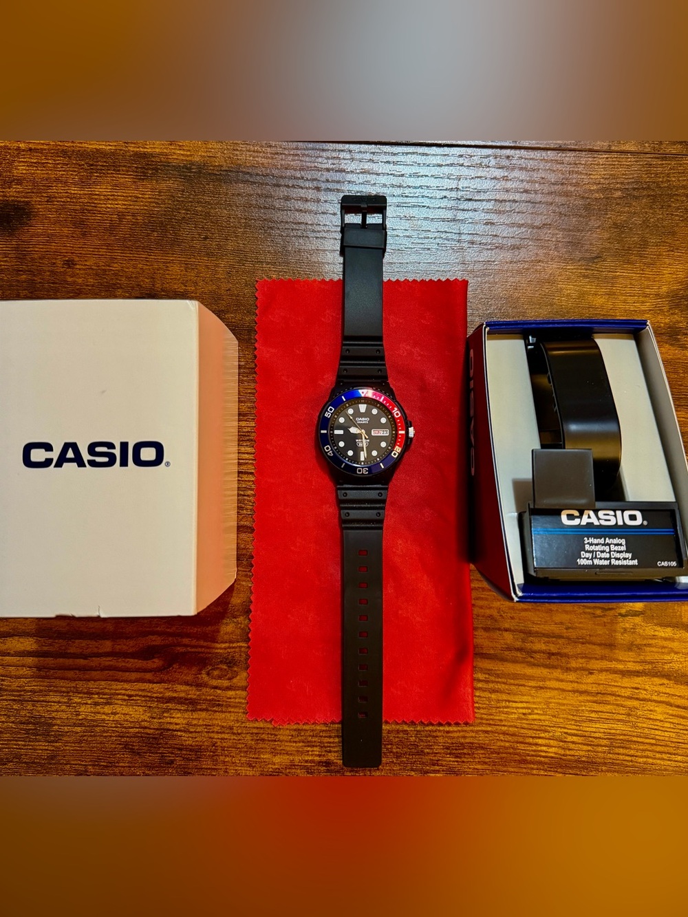Casio Black Dive-Style Watch with Red and Blue Bezel